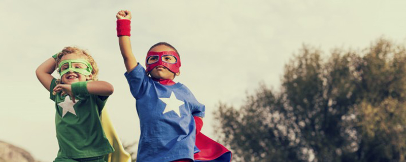 kids in super hero costumes showing confidence